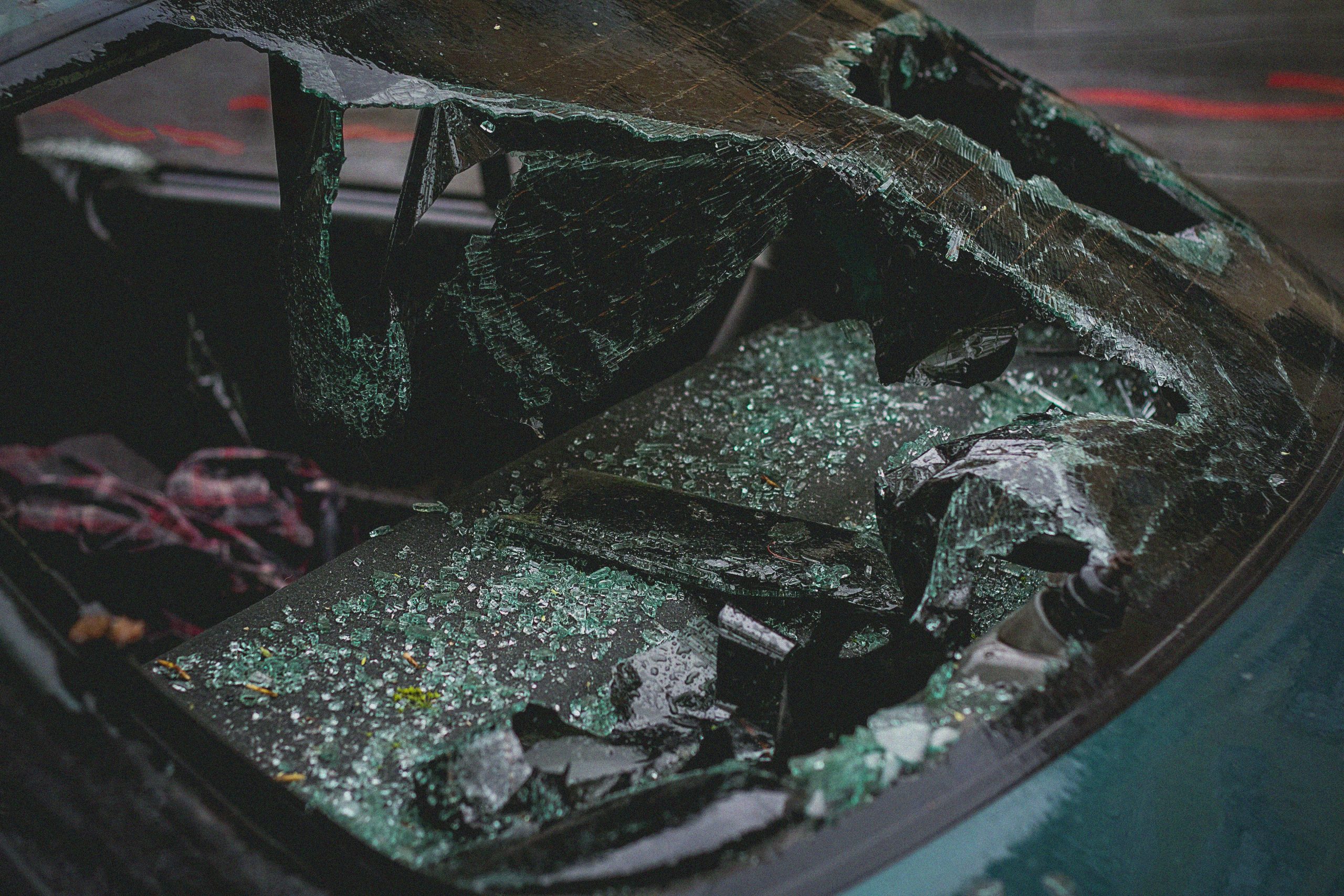 car's rear window with shattered glass